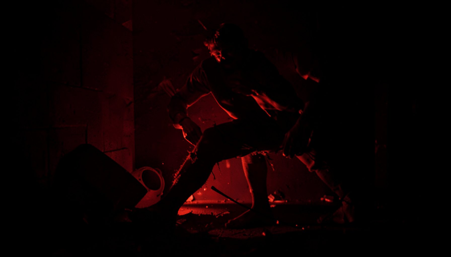 Dark room with harsh shadows, intense physical energy, aggressive red undertones