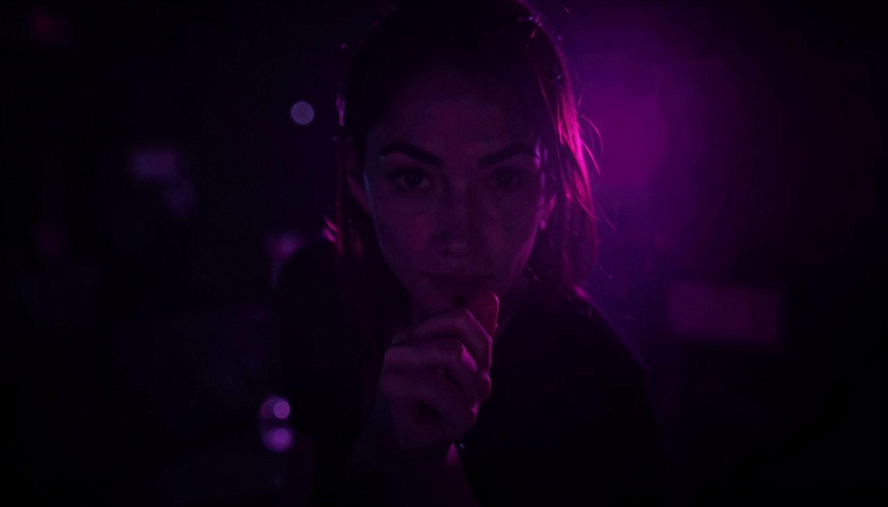 Dark atmospheric backdrop with deep purple and black tones, soft magenta glow, moody adult entertainment ambiance