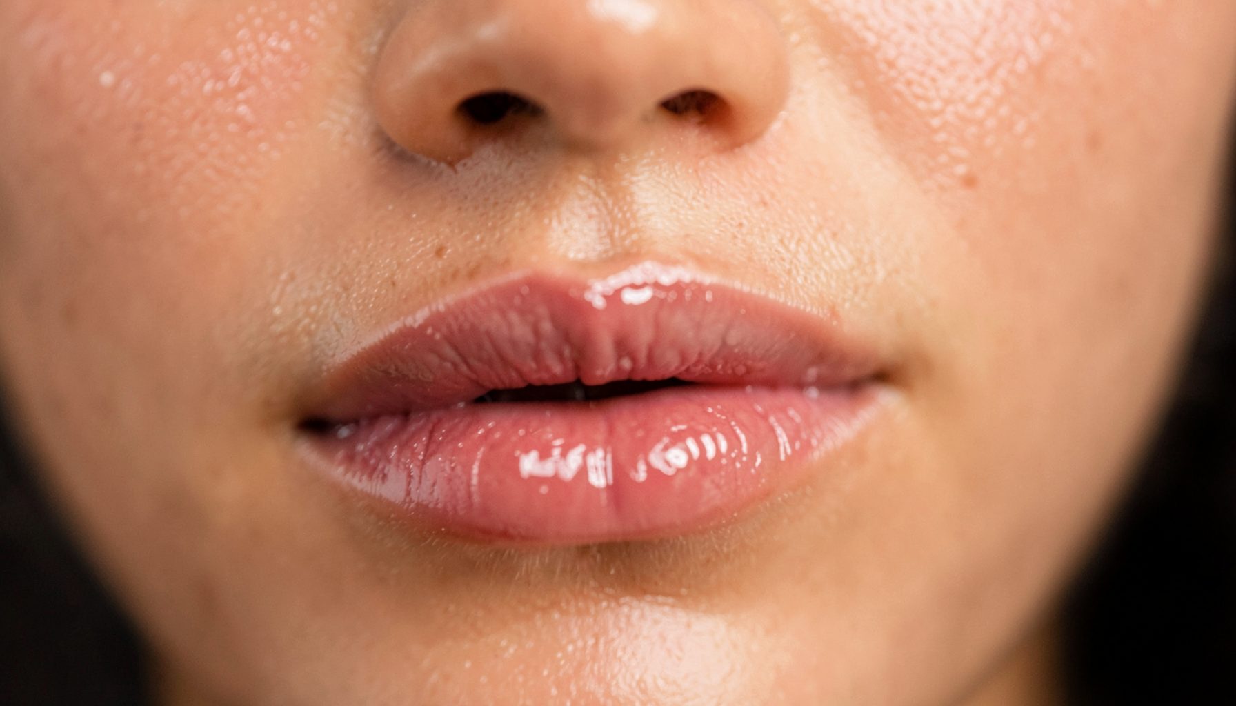 Close-up intimate framing, glossy lips, warm skin tones, sensual soft focus