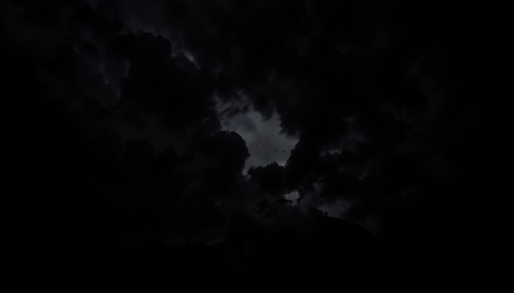 Dramatic scale contrast, deep shadows, powerful and imposing atmosphere