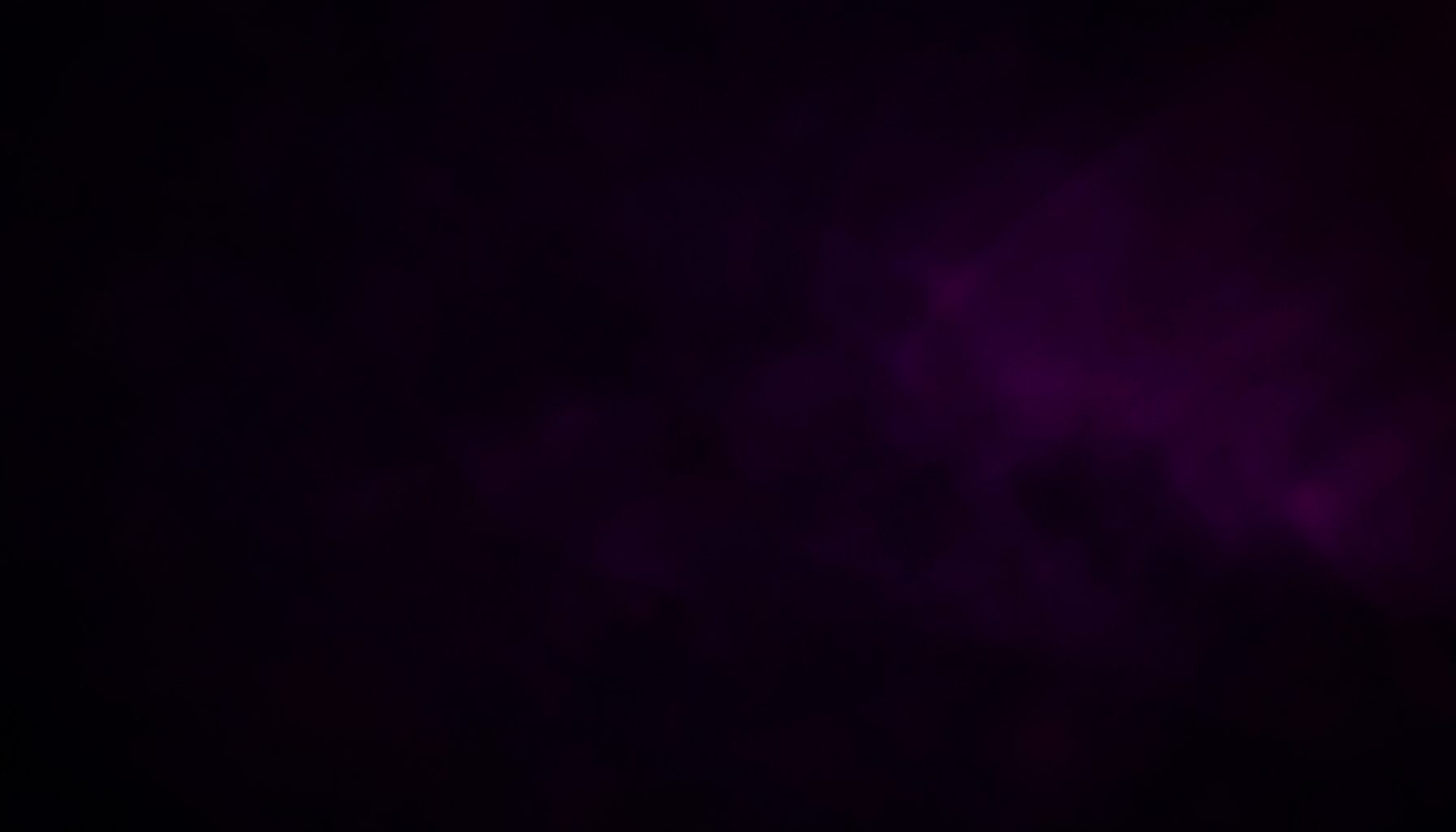 Dark atmospheric background with deep purple and magenta tones, a moody abstract glow suggesting late-night browsing energy